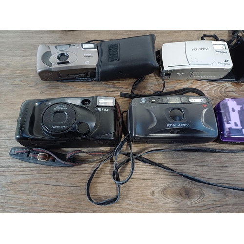 610 - A collection of compact cameras to include Minolta Riva Zoom 75W, Konica, Yashica, Halina etc.