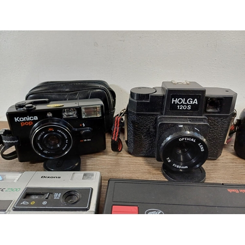 611 - A collection of vintage cameras to include Holga 120S for 120 film, Konica Pop, Kodak 'Brownie' 127,... 