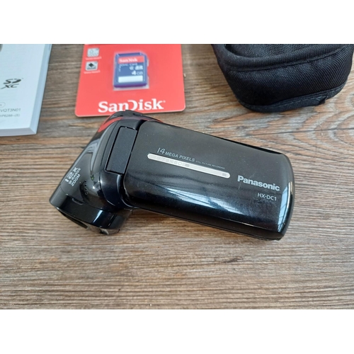 615 - A boxed Panasonic HX-DC1 14mp full HD digital camcorder fitted with 32GB memory card, with packaged ... 