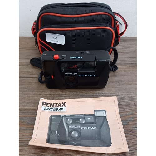 617 - A cased Pentax PC35AF autofocus 35mm compact camera with instruction manual