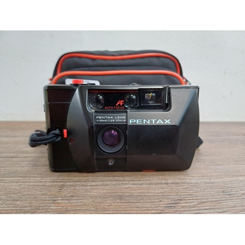 617 - A cased Pentax PC35AF autofocus 35mm compact camera with instruction manual