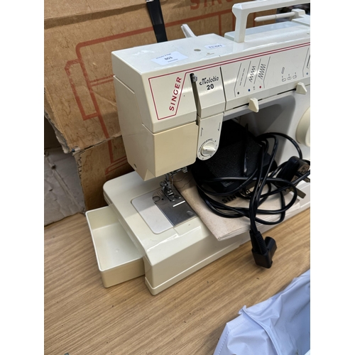 803 - A Singer Melodie 20 electric sewing machine with foot pedal and instruction manual