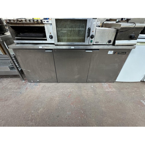 834 - A True Manufacturing Co. stainless steel three door catering bench refrigerator - approx. 184cm x 77... 