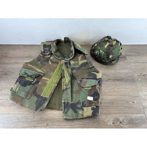 2232F - Two items, one US size large fragmentation protective vest and one military style plastic helmet