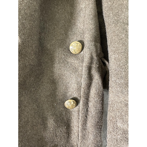 2232J - A green military overcoat with WWI British General Service Corps buttons