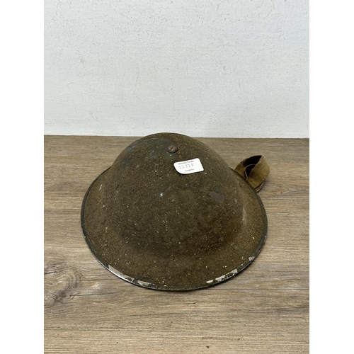 2232K - A WWII military helmet marked RAMC to underside