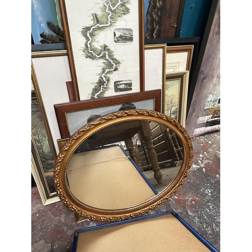 241 - A collection of framed pictures and mirrors to include 19th century style gilt framed oval wall mirr... 