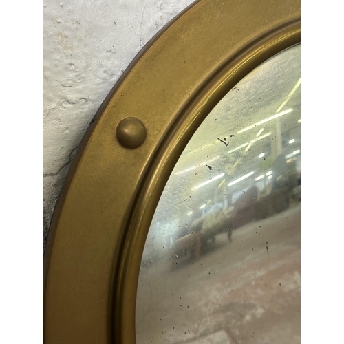 250 - A Regency style brass framed convex wall mirror - approx. 57cm diameter