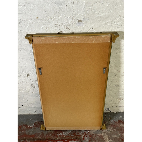 251 - A gilt framed bevelled edge wall mirror - approx. 80cm high x 52cm wide