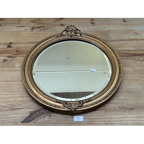 263 - A 19th century style gilt framed bevelled edge wall mirror - approx. 49cm diameter