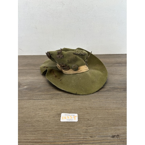 2233T - A military slouch hat with fitted cap badges to include South Staffordshire, Imperial Service, Royal... 