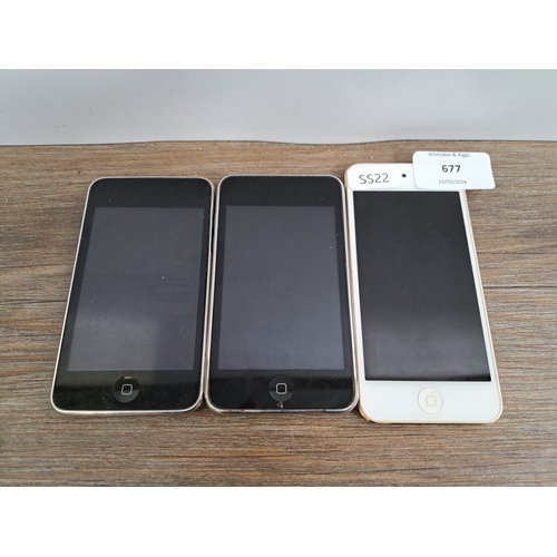 677 - Three Apple iPod Touch portable media players, one A1574 6th generation and two A1288 2nd generation