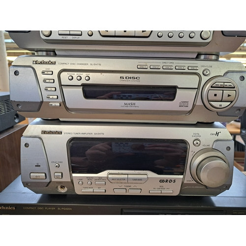 693 - Five items of Technics hi-fi, one SH-EH770 sound processor, one RS-DV250 Dolby B twin cassette deck,... 