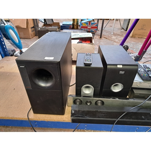 702 - A collection of AV items to include Bose Acoustimass 15 powered subwoofer, LG and Samsung soundbars,... 