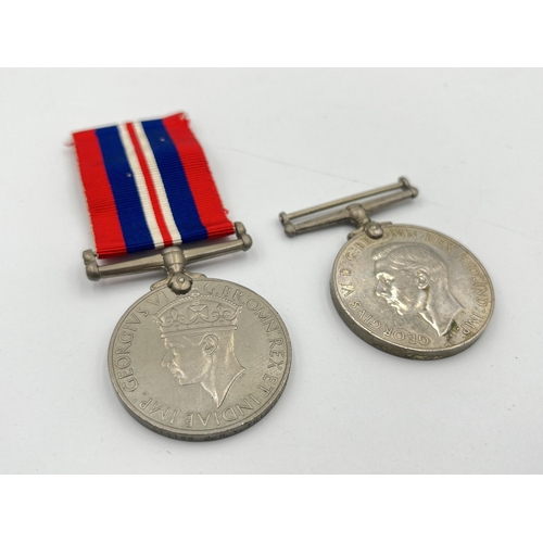 2232 - Two WWII British medals, one War presented to 571166 J. H. V. Thicthener and one Defense