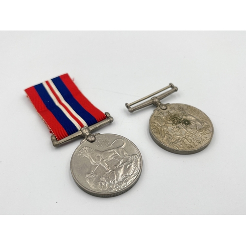 2232 - Two WWII British medals, one War presented to 571166 J. H. V. Thicthener and one Defense