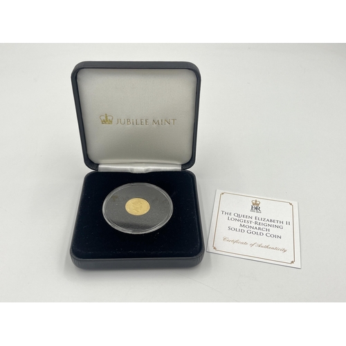 2234 - A boxed 2015 Jubilee Mint The Queen Elizabeth II Longest-Reigning Monarch 9ct gold proof One Crown c... 