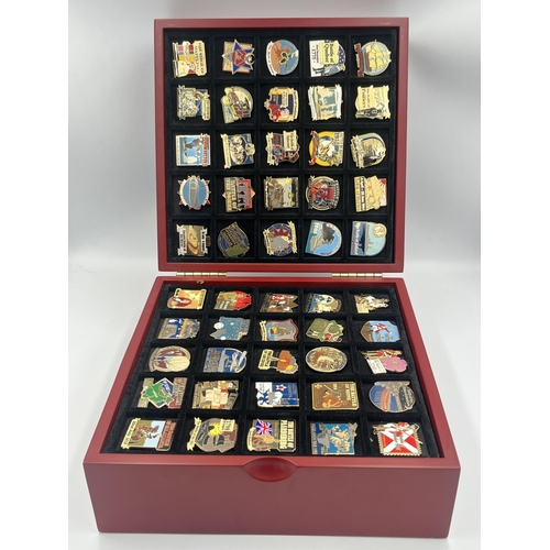 2248 - A cased collection of 50 Danbury Mint British Victory Collector pin badges