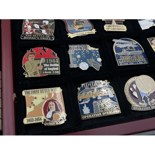 2248 - A cased collection of 50 Danbury Mint British Victory Collector pin badges