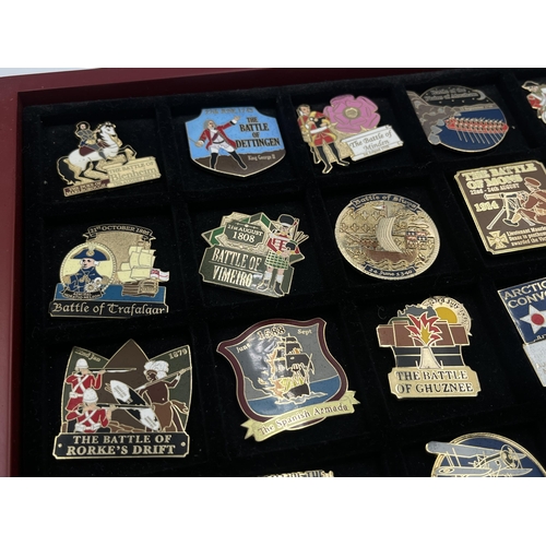 2248 - A cased collection of 50 Danbury Mint British Victory Collector pin badges