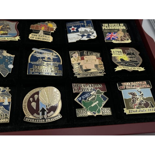 2248 - A cased collection of 50 Danbury Mint British Victory Collector pin badges