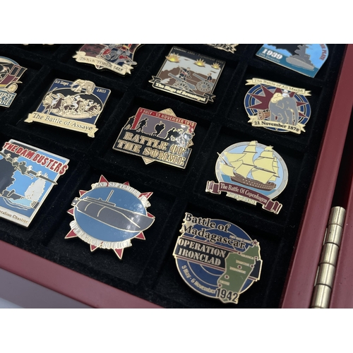 2248 - A cased collection of 50 Danbury Mint British Victory Collector pin badges