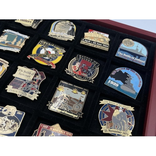 2248 - A cased collection of 50 Danbury Mint British Victory Collector pin badges