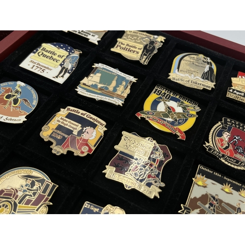 2248 - A cased collection of 50 Danbury Mint British Victory Collector pin badges