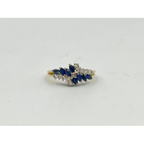 2330 - A hallmarked 18ct gold sapphire and diamond cluster ring, size P½ - approx. gross weight 3.9g