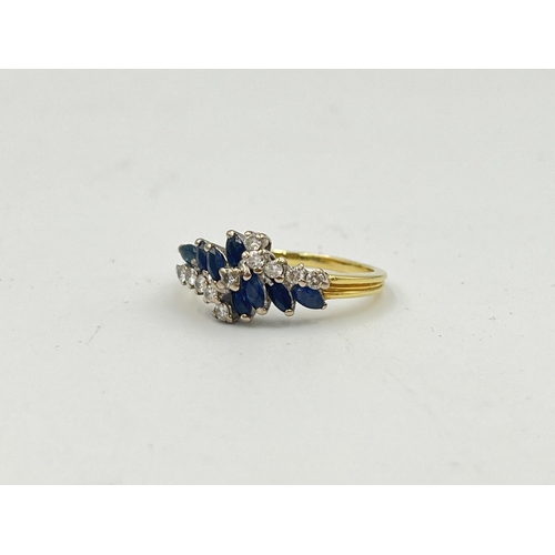 2330 - A hallmarked 18ct gold sapphire and diamond cluster ring, size P½ - approx. gross weight 3.9g