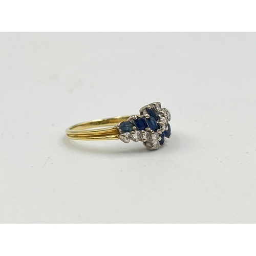 2330 - A hallmarked 18ct gold sapphire and diamond cluster ring, size P½ - approx. gross weight 3.9g