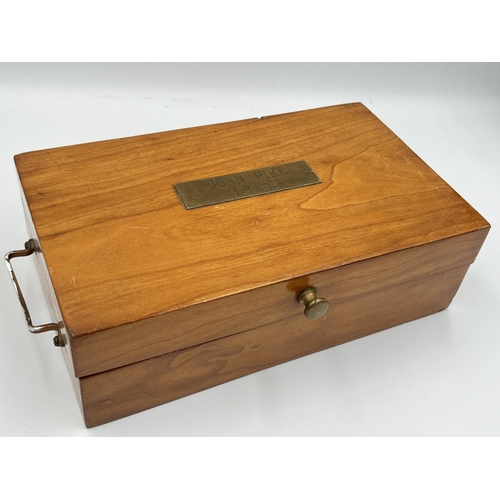 2343 - A 1960s hardwood presentation wristwatch case containing three quartz wristwatches to include two Ro... 