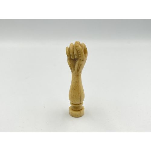 2350 - A boxed Victorian hand carved bone wax seal with hidden photograph of two nude ladies