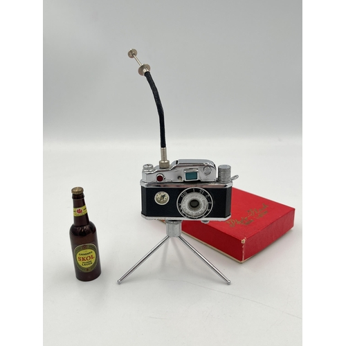 2351 - Two vintage items, one boxed Photo-Flash table lighter in the form of SLR camera and one bottle open... 