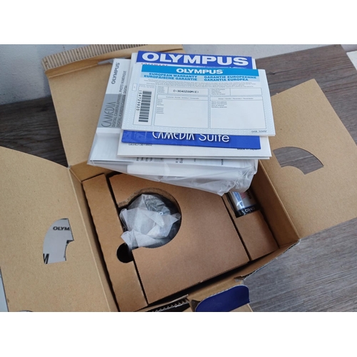 634 - Two boxed and packaged Olympus C-3040ZOOM Camedia 3.3mp digital cameras with software and accessorie... 