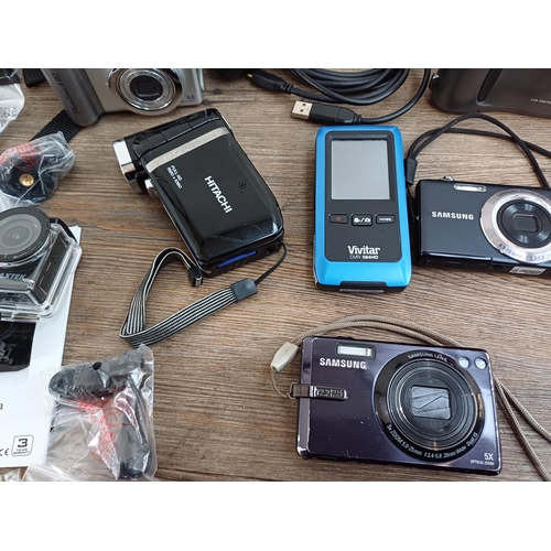 636 - A collection of digital cameras to include Samsung WB700, ST61 12.2mp and IT100 12.2mp, Maxtek Ultra... 