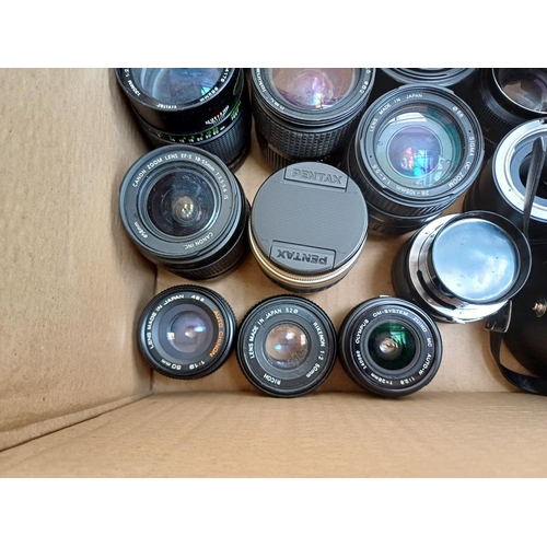 645 - A collection of camera lenses to include Vivitar, Canon, Olympus Zuiko, Sigma, Konica Hexanon etc.