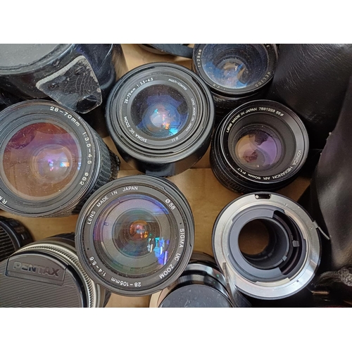 645 - A collection of camera lenses to include Vivitar, Canon, Olympus Zuiko, Sigma, Konica Hexanon etc.