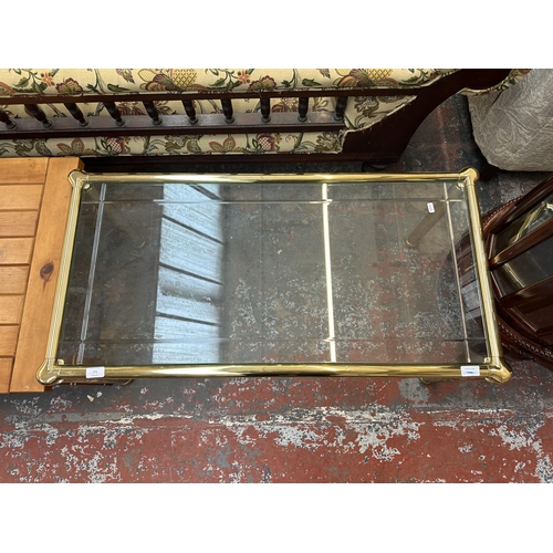 171 - A brass and bevelled glass coffee table