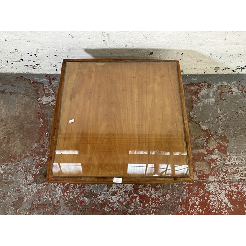 173 - A mid 20th century teak coffee table - approx. 38cm high x 71cm wide x 71cm deep
