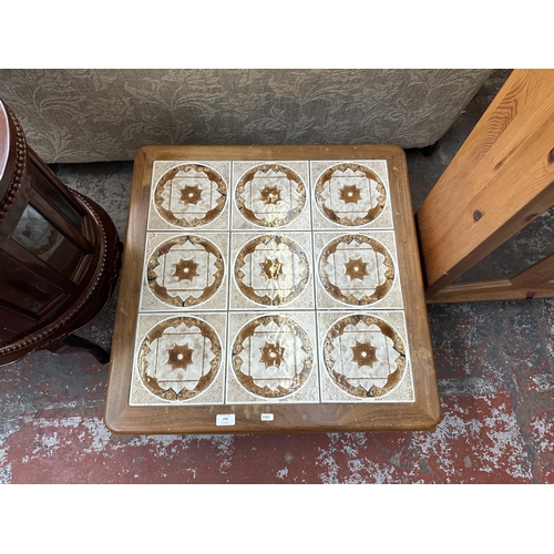 174 - A mid 20th century teak and tiled top coffee table - approx. 37cm high x 71cm wide x 71cm deep