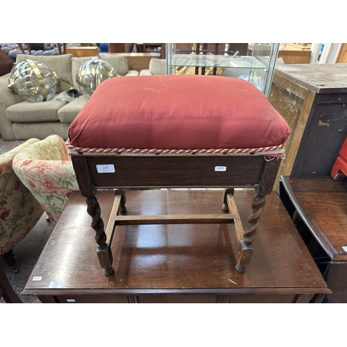 177 - A mid 20th century oak barley twist upholstered piano stool