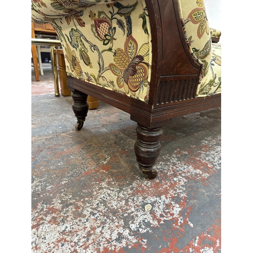 199 - A Victorian carved mahogany and floral fabric upholstered chaise longue - approx. 70cm high x 64cm w... 