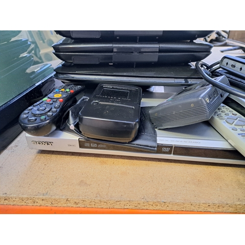 709 - A collection of AV items to include Sony DVP-NS36 DVD player, remote controls, portable DVD players ... 