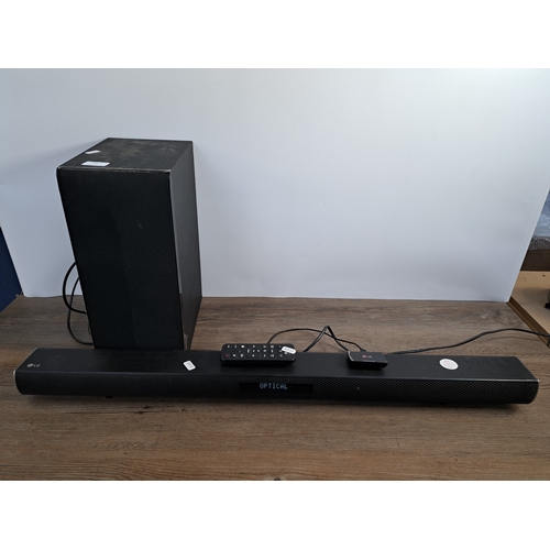 711 - A two piece LG Active AV speaker system comprising S55A1-D wireless subwoofer and LAS455H wireless s... 