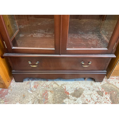 5 - A mahogany display cabinet with three glass shelves and key - approx. 150cm high x 86cm wide x 38cm ... 