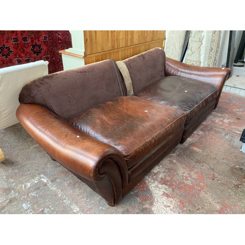 87 - A brown leather and fabric upholstered four seater sofa - approx. 79cm high x 252cm long x 106cm dee... 