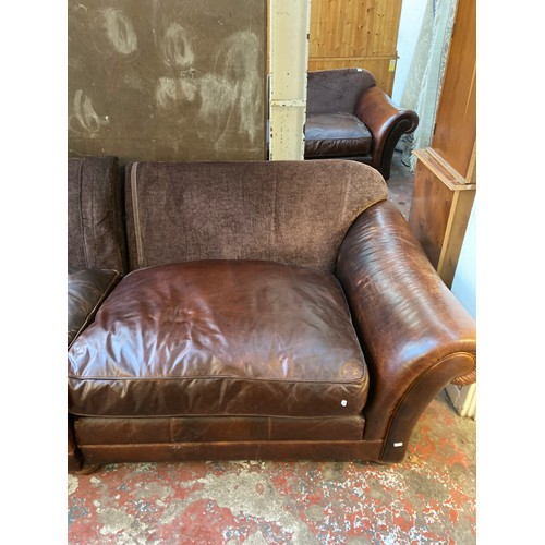 81 - A brown leather and fabric upholstered four seater sofa - approx. 79cm high x 252cm x 106cm