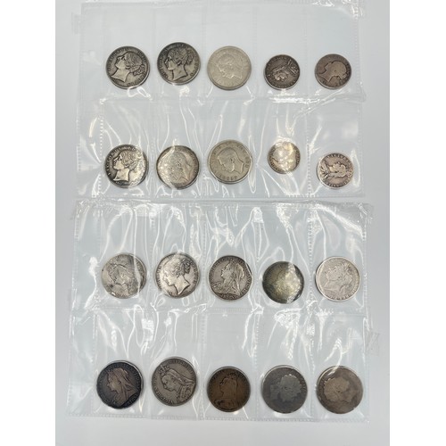 2245A - Twenty British silver coins and tokens to include 1845 Queen Victoria crown, two 1890 Queen Victoria... 