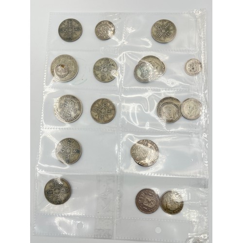 2245C - A collection of coins and medals to include twenty four .500 silver half crowns etc.